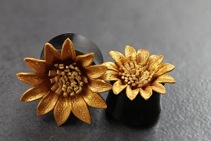 Painted Leather Golden Flower Flared Plugs